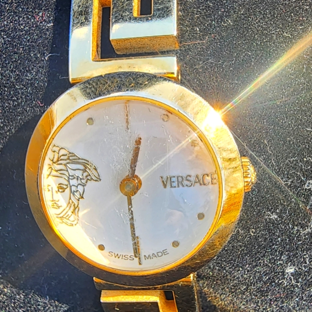 Gold Versace watch